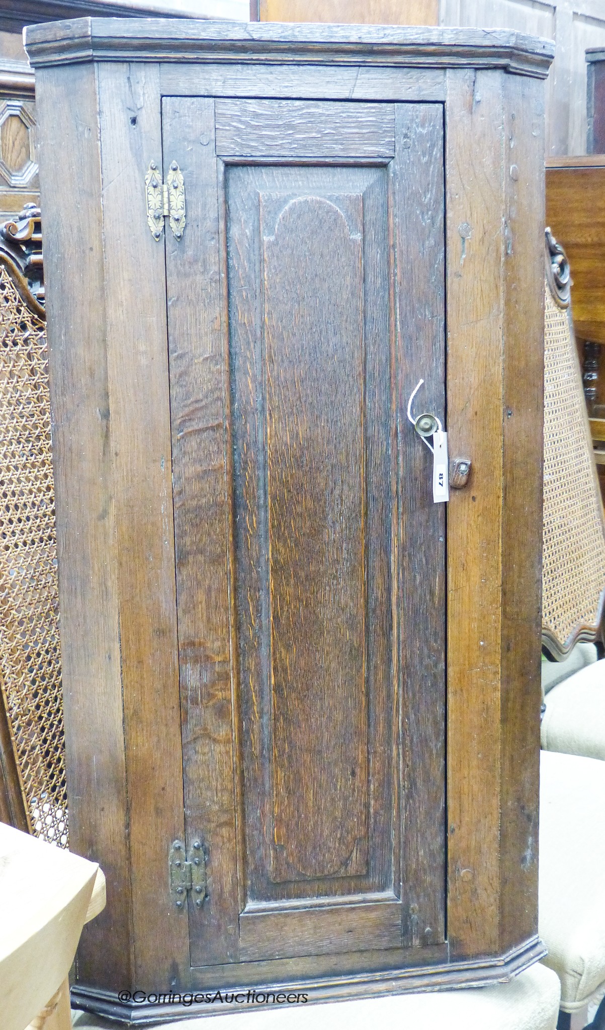 An 18th century and later oak corner cupboard, width 53cm, depth 30cm, height 101cm